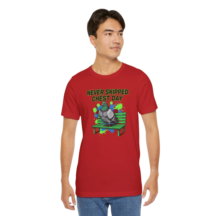 DailyThreadCo. red cotton t-shirt with a graphic print of a pigeon on a bench, text reads "NEVER SKIPPED CHEST DAY".
