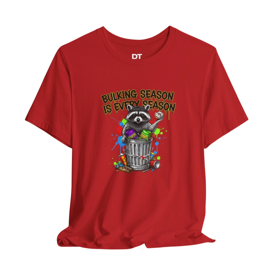 DailyThreadCo. red 100% cotton t-shirt with a funny graphic of a raccoon in a trash can with the text "BULKING SEASON IS EVERY SEASON".