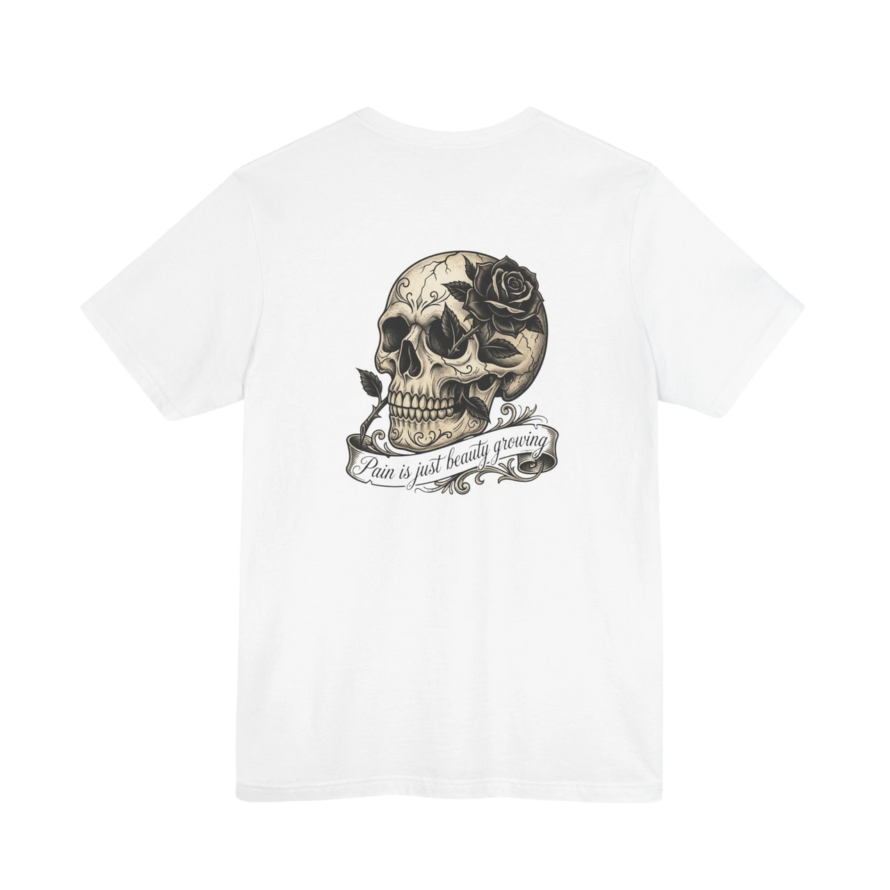 DailyThreadCo. white cotton t-shirt with a graphic print of a skull with a rose and the text "Pain is just beauty growing".