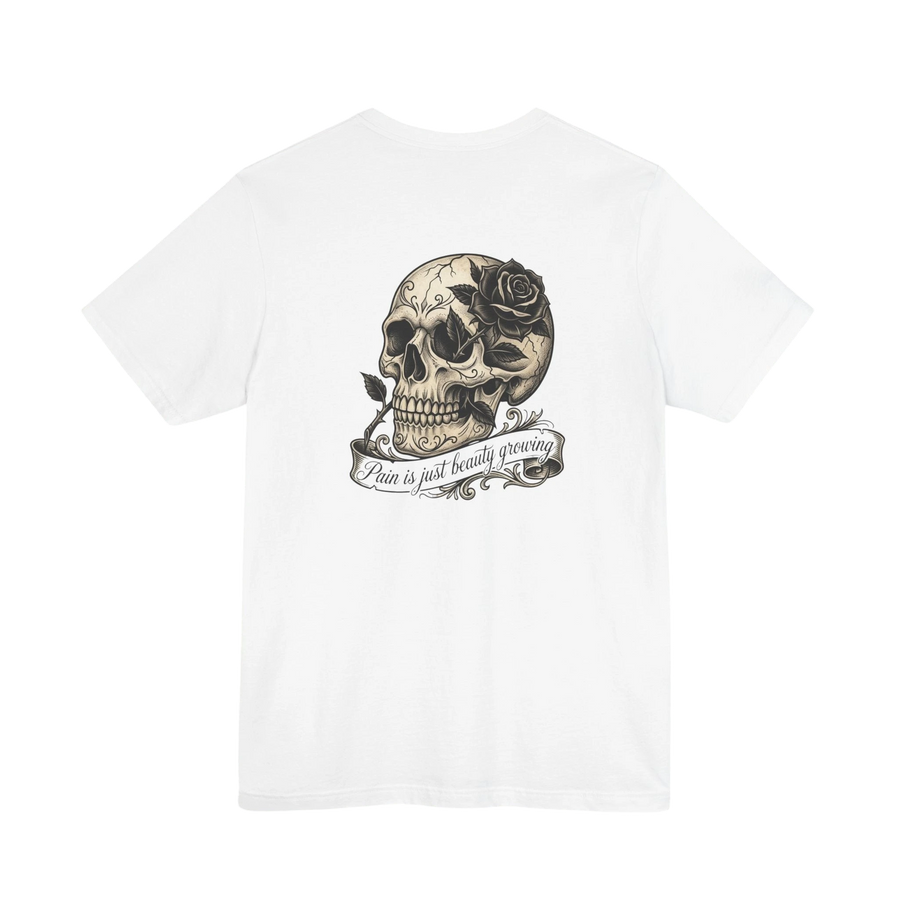 DailyThreadCo. white cotton t-shirt with a graphic print of a skull with a rose and the text "Pain is just beauty growing".