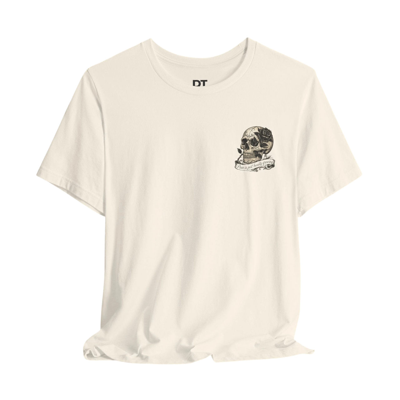 DailyThreadCo. cream 100% cotton graphic tee with skull and rose artwork and quote "Pain is just beauty growing".