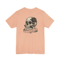 DailyThreadCo. peach cotton tee with hand-drawn skull and rose graphic on back. Text reads 