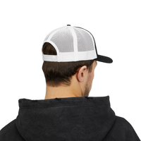 DailyThreadCo. black and white trucker cap with breathable mesh back and adjustable snapback worn by a man.