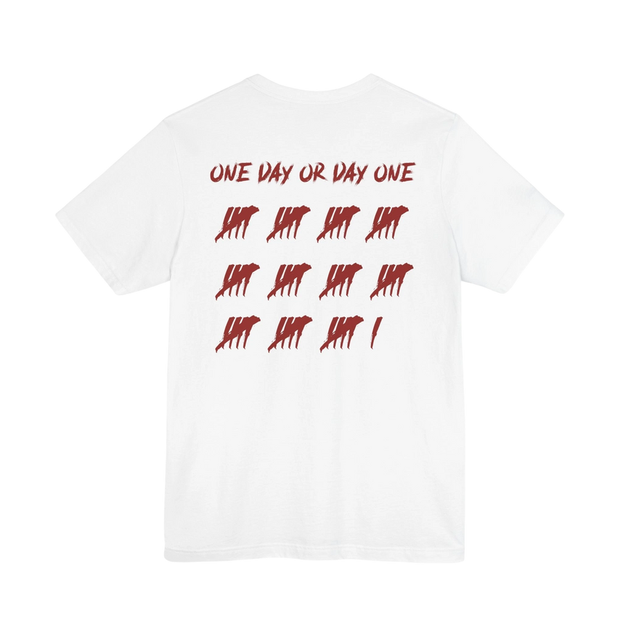 DailyThreadCo. white cotton t-shirt featuring a red One Day or Day One graphic with tally marks on the back.